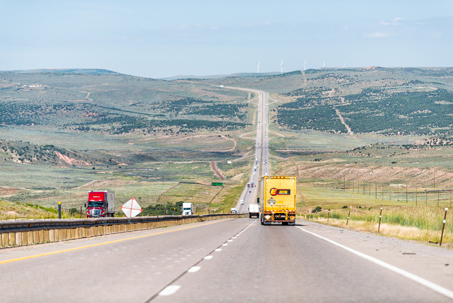 on interstate 80 highway with trucks, cars and incline