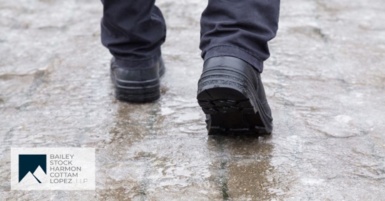 man walking on icy sidewalks
