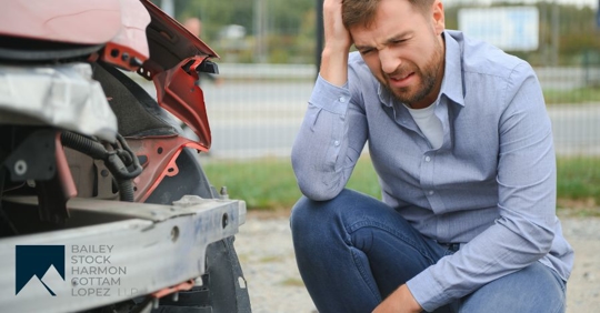 man in front of a car crash
